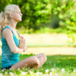 Young woman doing yoga exercise